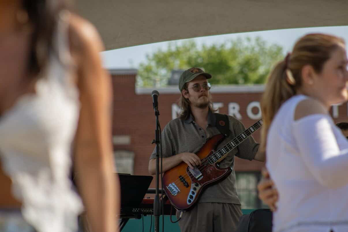 Orquesta Afinke bassist performing outdoors